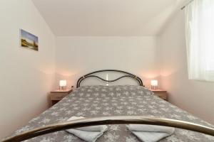 Postel nebo postele na pokoji v ubytování Apartment Mladen 1860