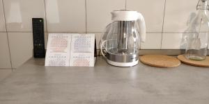 a kitchen counter with a blender on a counter top at La Dimora di Enea in Rome