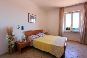 Postel nebo postele na pokoji v ubytování Hotel Holiday Bambù