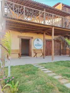 a building with a sign that reads seawustainable at Pousada Sea Wind kite Preá in Prea