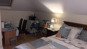 a bedroom with a bed and a table and a desk at Country Haven eircode H54 AK31 in Galway