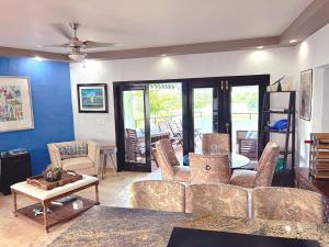 a living room with a couch and chairs and a table at Come, Enjoy & Relax at Rio Mar Cluster II, Rio Grande, PR in Rio Grande