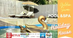 a sign with a swan in a swimming pool at 5 Bedroom 3 bathroom House with Pool, Spa, Voice-Control Smart Home and Game Room in Sydney