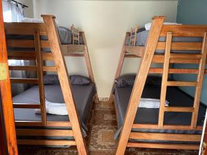 two sets of bunk beds in a room at HOSTAL LA CASA DE LOS SUEÑOS in Jardin
