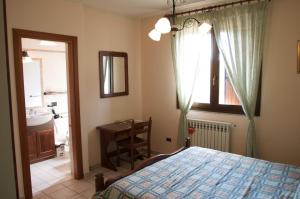 A bed or beds in a room at Azienda Agrituristica Salella