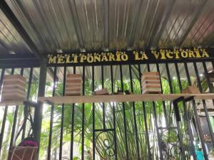 a metal cage with chairs and a sign on it at CASA DE CAMPO LA VICTORIA in Rivera