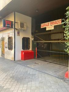 an entrance to a building with a gate in front at Moncloa apartment, con parking in Madrid