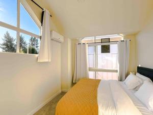 a bedroom with a bed and a large window at Central Seattle Peaceful Private Retreat 10 Mins Walk From Groceory Store in Seattle