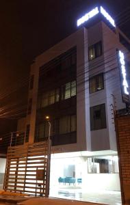 a building with a light on top of it at night at Stelar Hostal in Cuenca