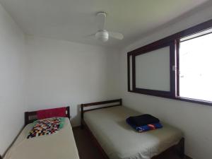 Postel nebo postele na pokoji v ubytování Linda Casa em Itapoá, balneário Paese