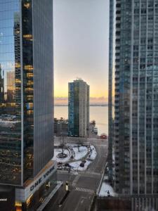 a view of a city with tall skyscrapers at Home Away From Home in Toronto