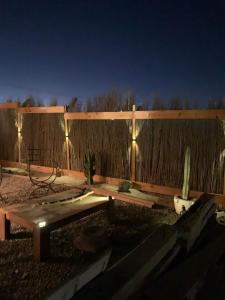 a backyard with a fence and a cactus at Loft la herradura in Coquimbo