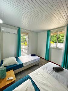 Voodi või voodid majutusasutuse Villa Sweet Caraïbes, vue mer, jacuzzi toas