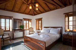 A bed or beds in a room at Likinia Hotel