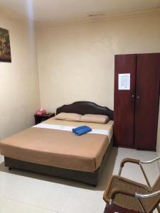 Postel nebo postele na pokoji v ubytování Hotel Sekawan + 25 fotografií