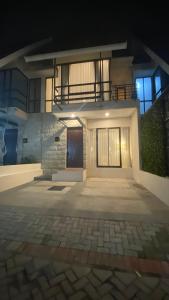 a house with a front door at night at Kallea Villas in Tlekung