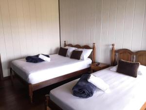 Ένα ή περισσότερα κρεβάτια σε δωμάτιο στο Hotel Aurora Inn, Nuevo Arenal