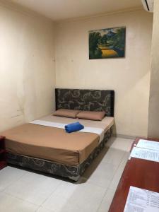 Postel nebo postele na pokoji v ubytování Hotel Sekawan