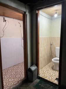 a bathroom with a shower and a toilet at Bali Sunrise Camp & Glamping in Kintamani