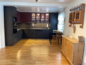 a kitchen with a counter and a dining room at Holiday home Korsfjorden in Komagfjord