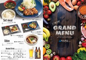 a table with a menu and a bunch of food at Hotel Marion in Suzuka