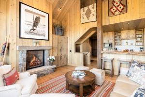 a living room with a fireplace in a house at 5 Bandit Way by Moonlight Basin Lodging in Big Sky