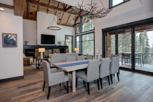 a dining room with a table and chairs at 6 Jakes Lane by Moonlight Basin Lodging in Big Sky +33 photos