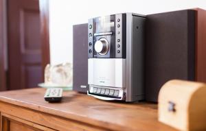 a microwave oven sitting on top of a wooden table at Guesthouse Nina in Sarajevo