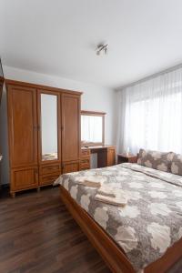 Postel nebo postele na pokoji v ubytování Karastoyanovi's apartment 3
