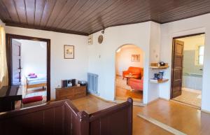 a living room with a couch and a bedroom at Guesthouse Nina in Sarajevo