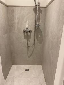 a shower with a hose in a bathroom at Casitas de Boracay in Boracay