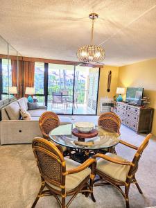 a living room with a table and chairs at Cozy Condo in Kihei at Kamaole Sands Building 3 Unit 202 in Wailea