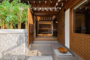 a hallway of a house with plants at Luxury hanok with private bathtub - SW09 in Seoul