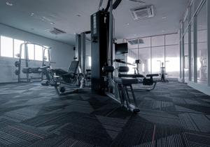 a gym with two tread machines in a room at Inap Tanjung Homestay in Kuala Terengganu