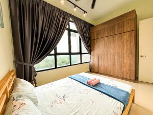 เตียงในห้องที่ Ha-aH⁴ Home@nearby IOI Resort,3BR w Balcony