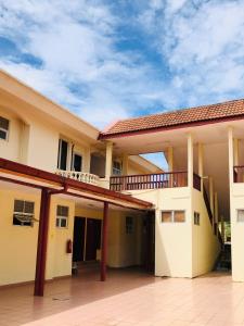 a large building with a balcony on top of it at Intan Beach Resort in Kuala Terengganu