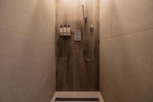 a shower stall in a bathroom with a shower at Luxury hanok with private bathtub - SN08 in Seoul