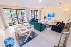 Et opholdsområde på Acacia Bee 4 Bedroom