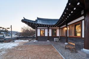 a building with a bench in front of it at Luxury hanok with private bathtub - IG01 in Incheon