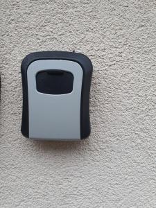 a black and white object on the side of a wall at Bloom Apartament in Alba Iulia