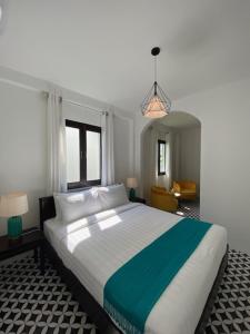 A bed or beds in a room at Fides Boutique Hotel