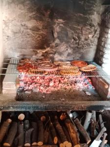 a grill with a bunch of pastries and donuts at Can Pitu Ferrer in Peralada