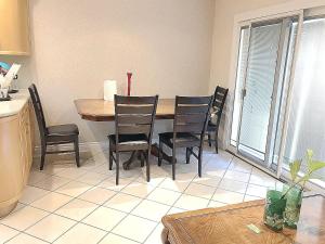 a dining room with a table and chairs in a kitchen at New bedroom queen size bed at Las Vegas for rent-2 in Las Vegas