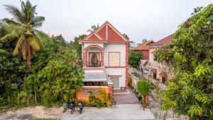 a house on the side of a hill at The Khmer House Villas in Siem Reap