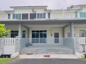a white house with a gate in front of it at NOOR Homestay Paddy View in Kangar