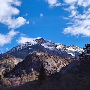 a house on the top of a mountain at El Serrablo AVAIRENT Sabiñánigo in Sabiñánigo