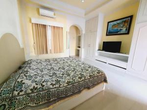 Postel nebo postele na pokoji v ubytování P.House Chiangrai