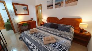 Łóżko lub łóżka w pokoju w obiekcie Rico Apartaments Ricosol