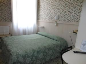 Postel nebo postele na pokoji v ubytování Hotel Stipino