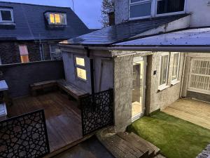 an external view of a house with a wooden deck at Luxury 2 Bedroom Apartment in S10 1GD in Walkly